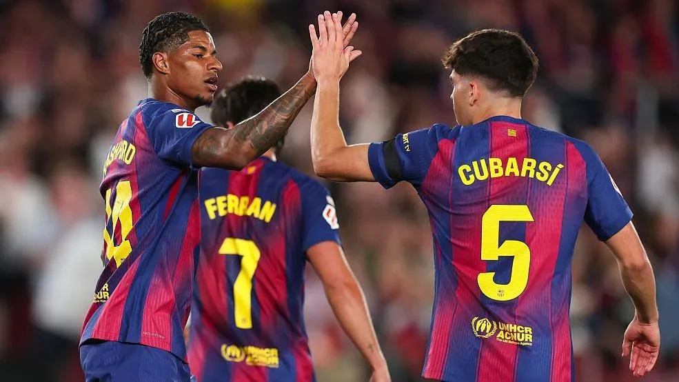 Marcus Rashford and his Barcelona team-mates celebrate his goal against Real Madrid